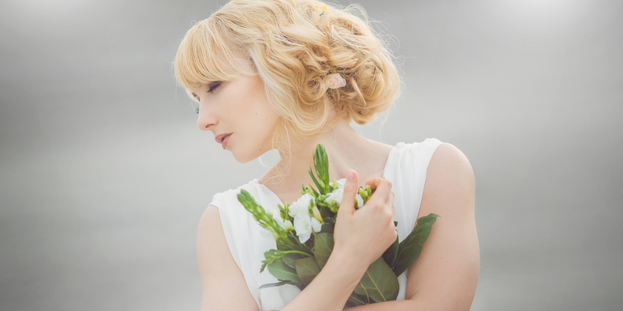 Young beautiful bride with a wedding bouquet